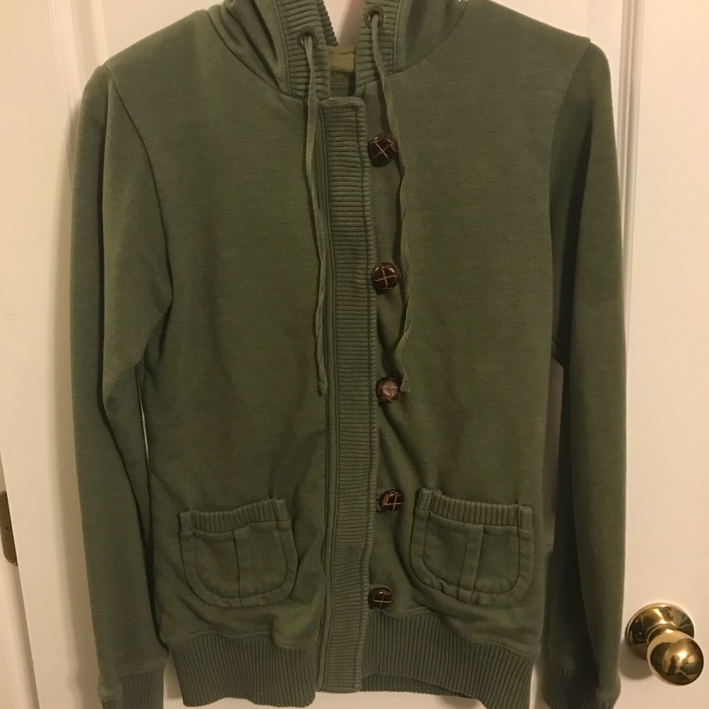 Women’s zip up sweatshirt with buttons.